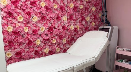 Treatment room with floral wall at My Beauty Lounge in London, England, GB, offering a serene spa experience.