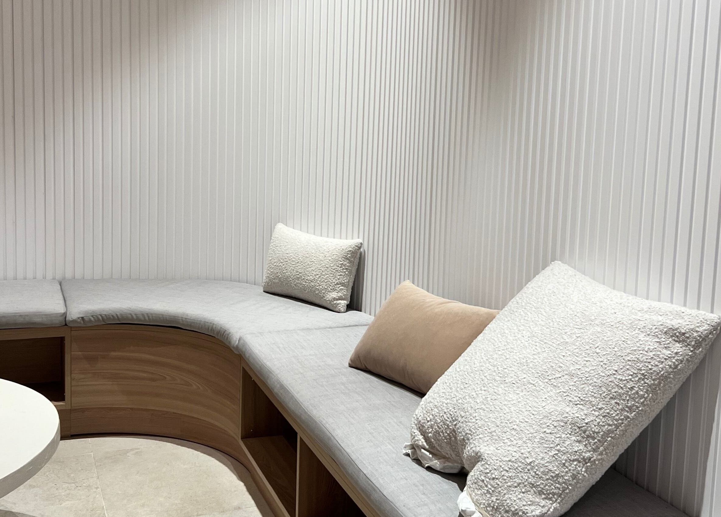 Elegant seating area at Luna Beauty Studio - The Clinica, Richmond Hill, Ontario, CA with plush cushions.