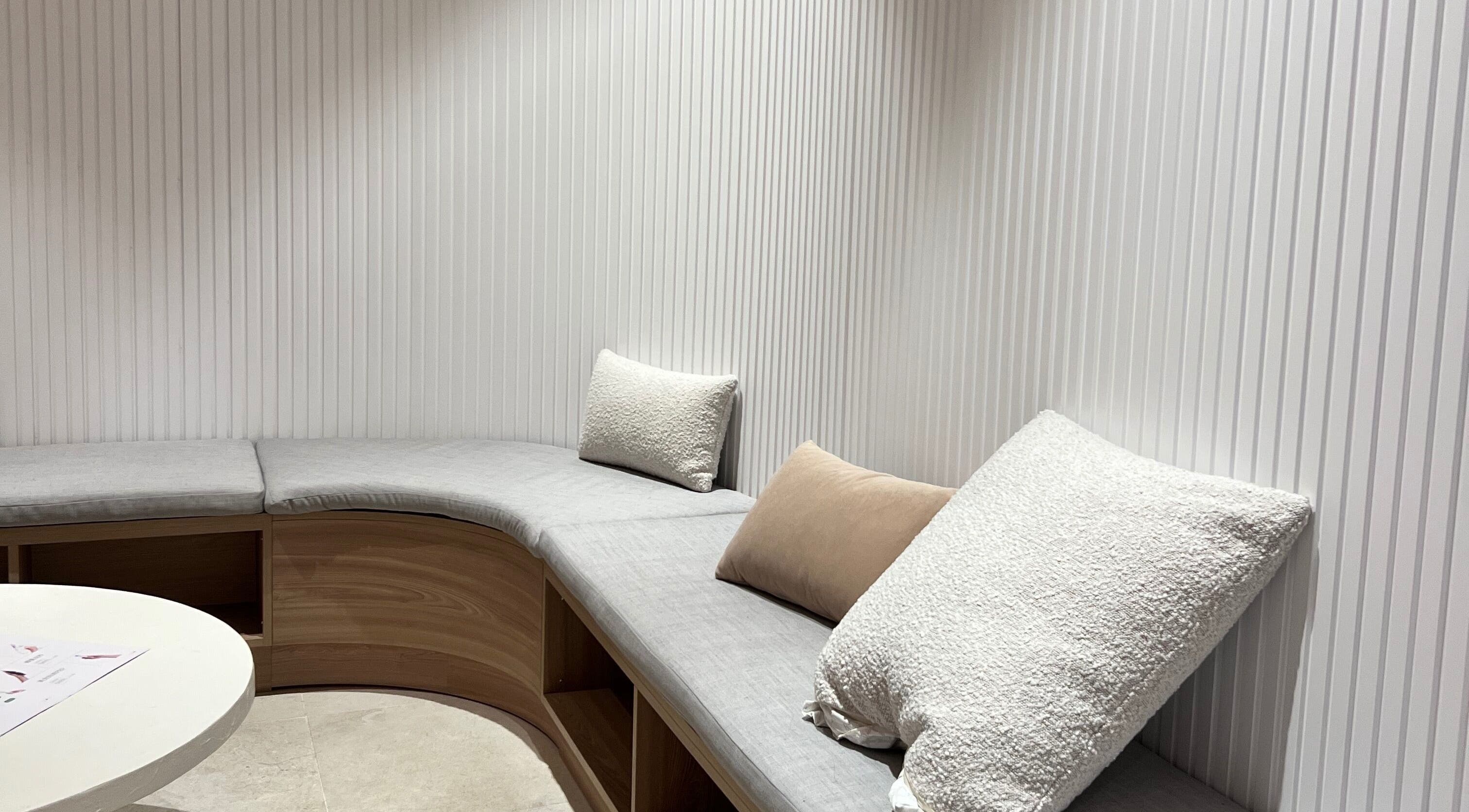 Elegant seating area at Luna Beauty Studio - The Clinica, Richmond Hill, Ontario, CA with plush cushions.