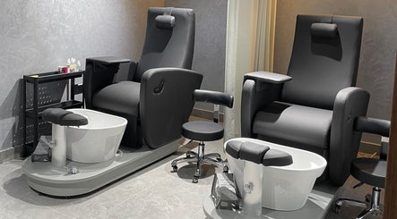 Luxurious pedicure chairs at Urban Global Barbershop, Abu Dhabi, AE, offer comfort and style.