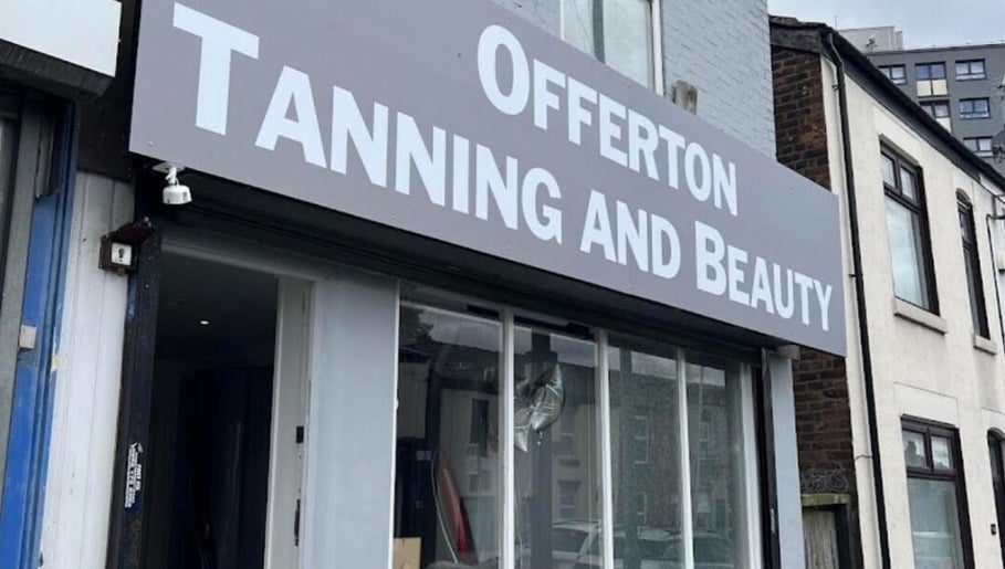 Front view of Offerton Tanning & Beauty in Stockport, England, GB, showcasing its sleek storefront design.
