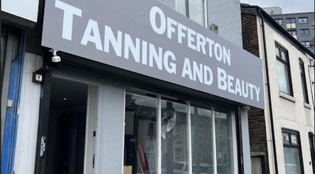 Front view of Offerton Tanning & Beauty in Stockport, England, GB, showcasing its sleek storefront design.