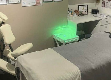 Serene wellness room at Offerton Tanning & Beauty in Stockport, England, GB with calming decor and treatment bed.