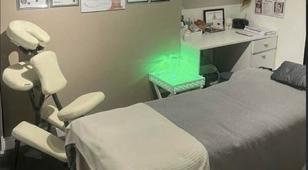 Serene wellness room at Offerton Tanning & Beauty in Stockport, England, GB with calming decor and treatment bed.
