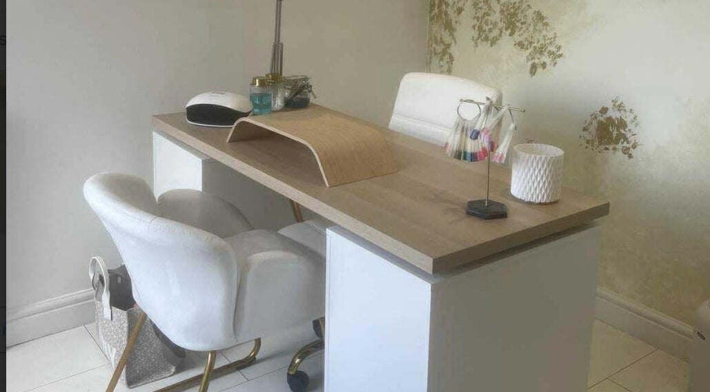 Manicure station at Offerton Tanning & Beauty in Stockport, England, GB featuring a chic white and wood decor.