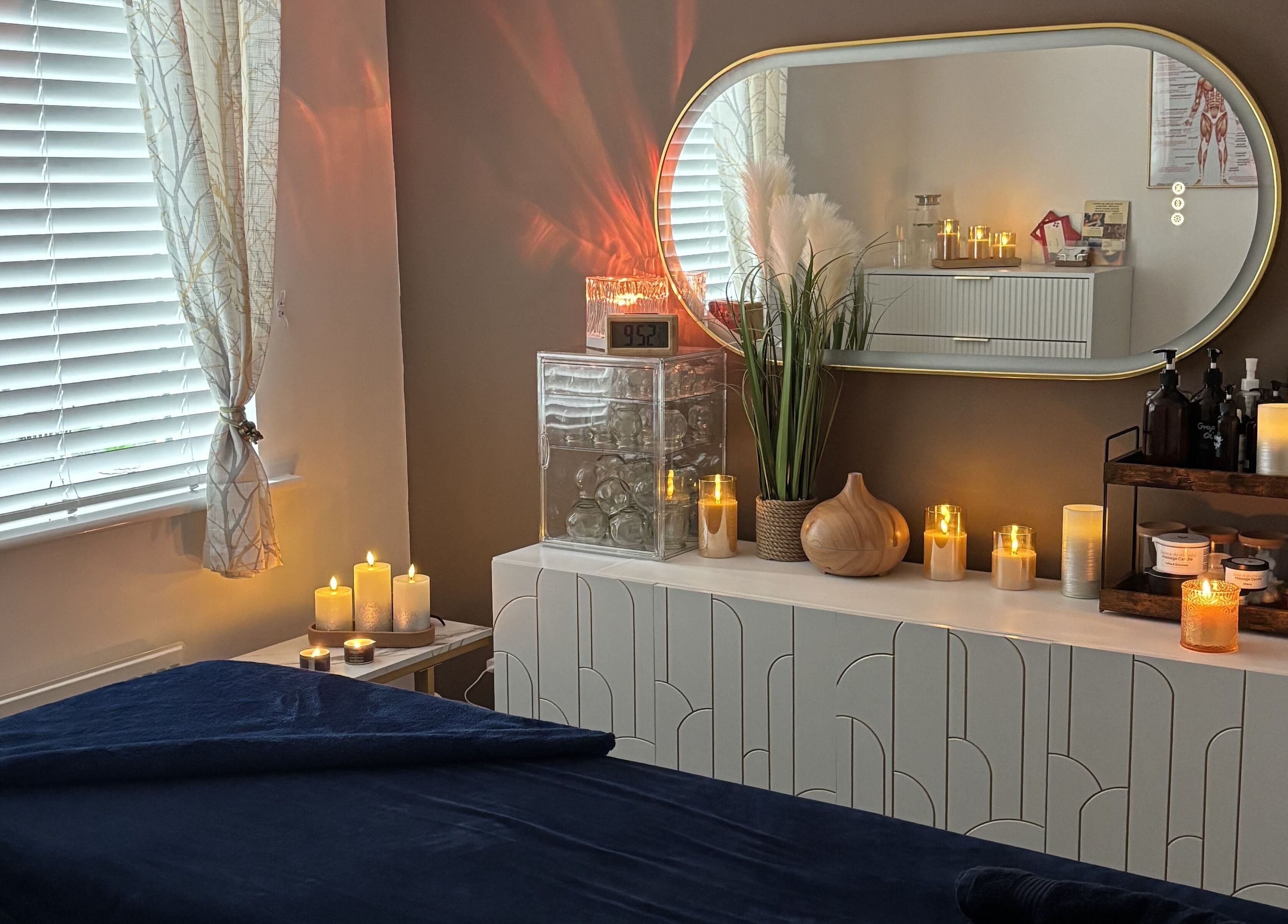 SC Sports Massage therapy room in Rugby, England, GB with candles and massage table.