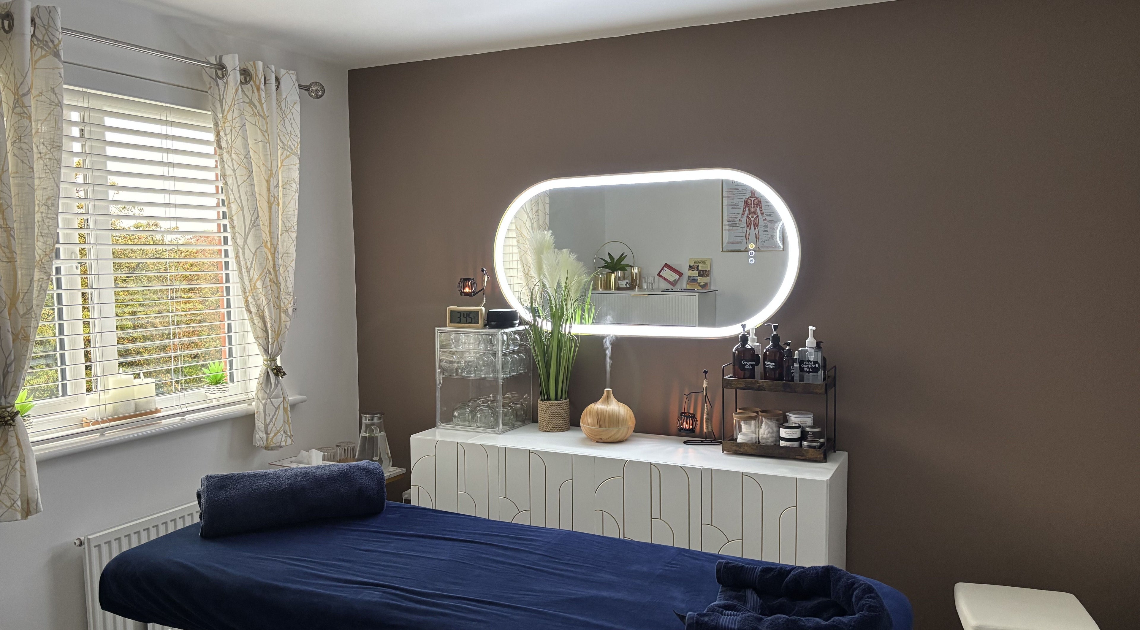 Massage room at SC Sports Massage in Rugby, England, GB, featuring soothing decor and wellness products.