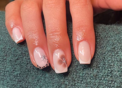 Stylish nail art at Rhea Manicure, Manchester, England, GB, showcasing intricate designs and polished elegance.