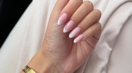 Elegant French manicure at Rhea Manicure, Manchester, England, GB showcasing stunning nail art design.