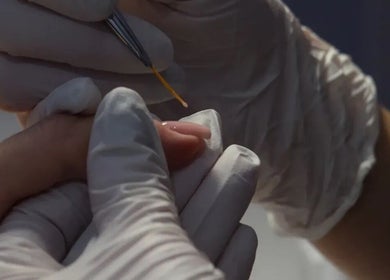 A detailed view of a manicure process at Rhea Manicure, Manchester, England, GB showcasing precision and care.