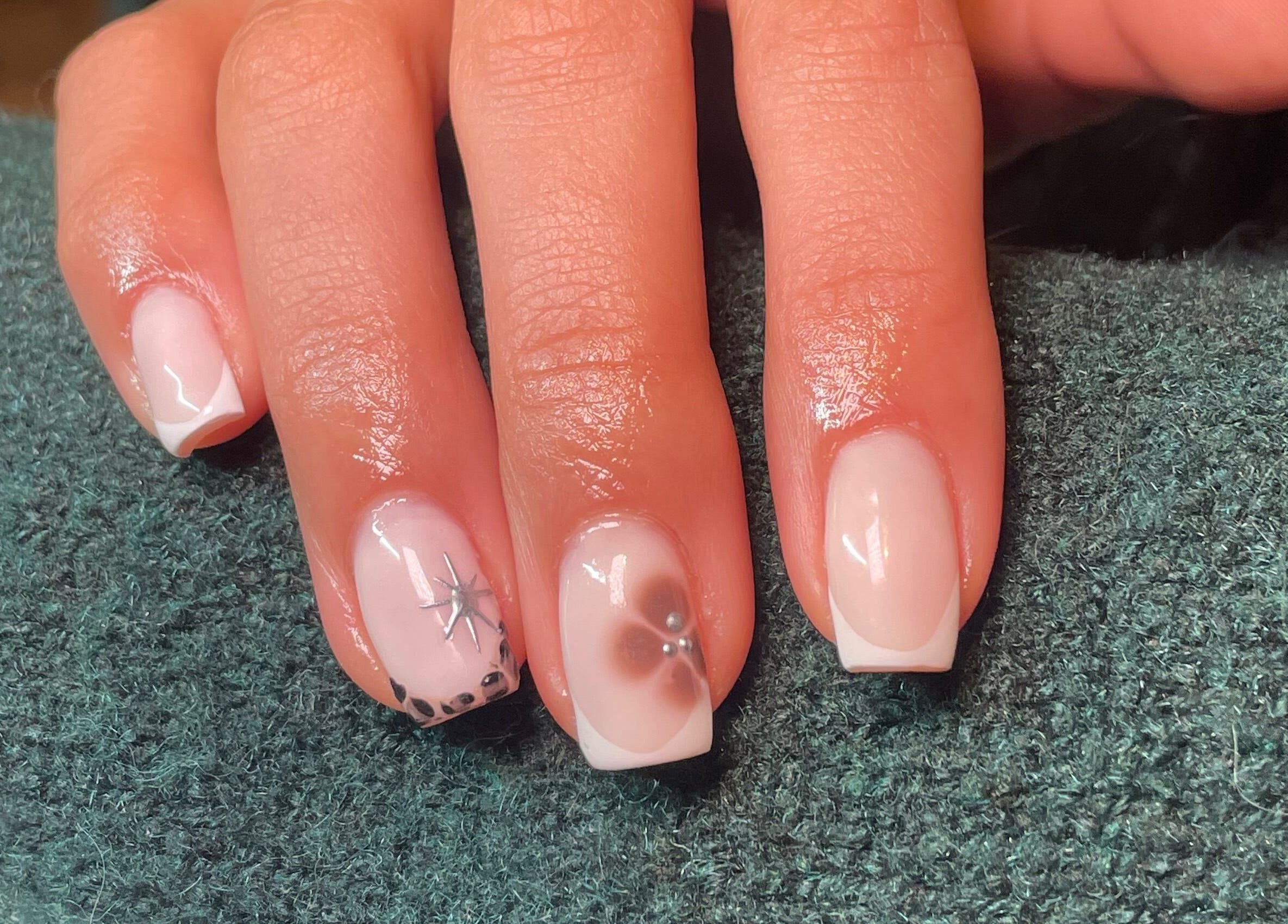 Beautiful nail art at Rhea Manicure, Manchester, England, GB showcasing intricate floral designs.