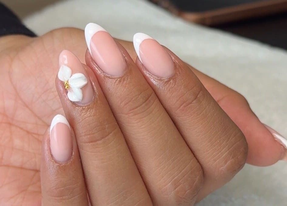 Elegant floral French manicure at Rhea Manicure, Manchester, England, GB.