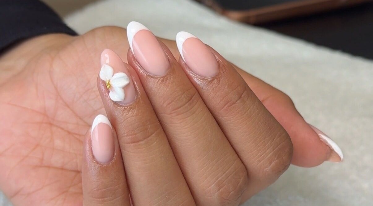 Elegant floral French manicure at Rhea Manicure, Manchester, England, GB.