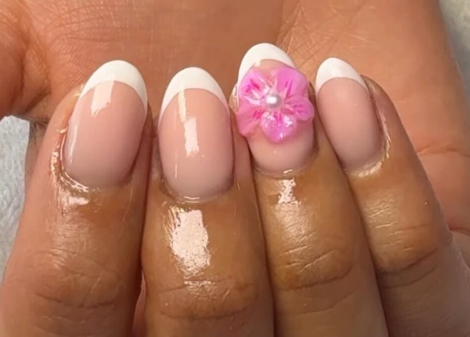 Elegant French and pink floral manicure by Rhea Manicure in Manchester, England, GB.