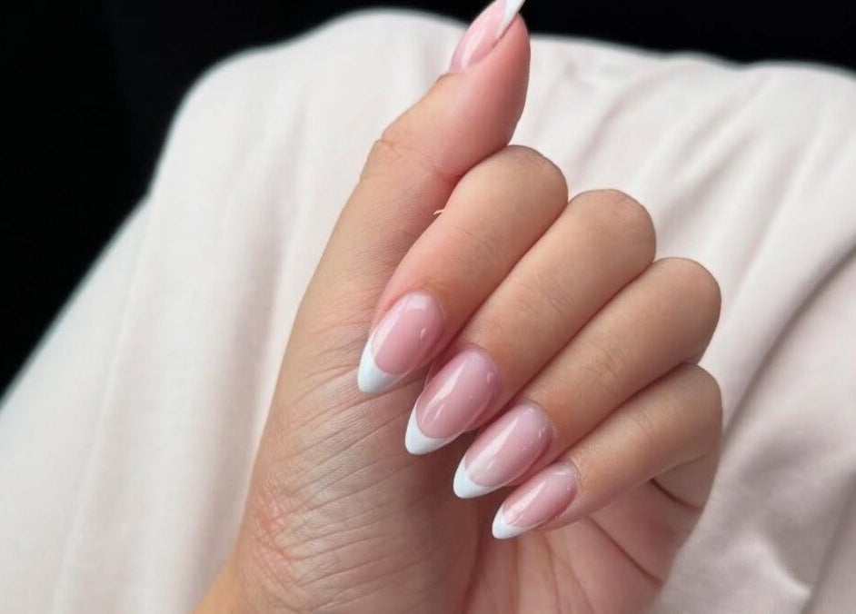 French manicure nail art at Rhea Manicure, Manchester, England, GB. Perfectly shaped nails with classic style.