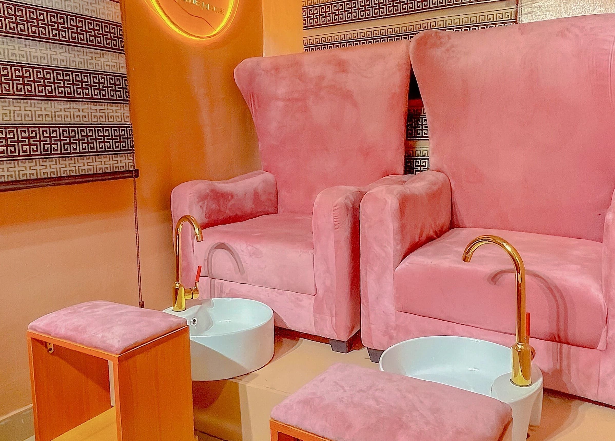 Luxurious pink pedicure chairs at KNG Beauty Bar, Lagos, Lagos, NG enhance the soothing spa experience.