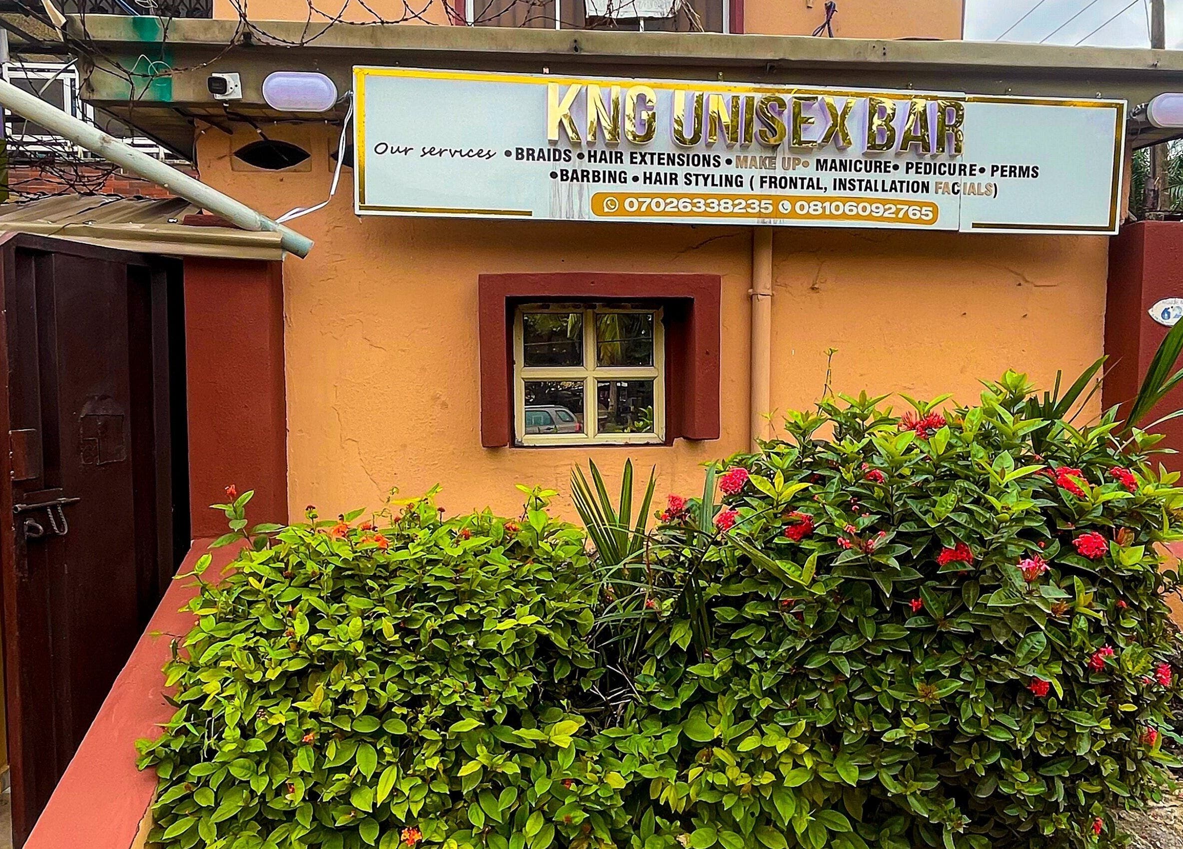Front view of KNG Beauty Bar in Lagos, Lagos, NG, showcasing lush greenery and welcoming entrance.