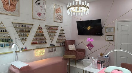Elegant nail and beauty station at CuteTique Salon, Kissimmee, Florida, US with chic decor and cozy seating.