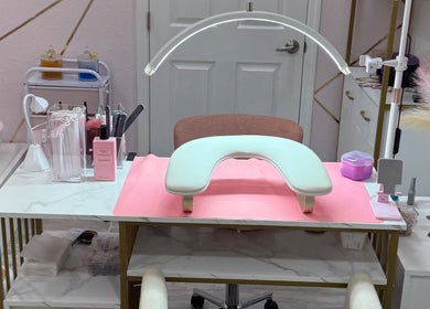 Nail care station at CuteTique Salon in Kissimmee, Florida, US, featuring manicure tools and a cozy chair.