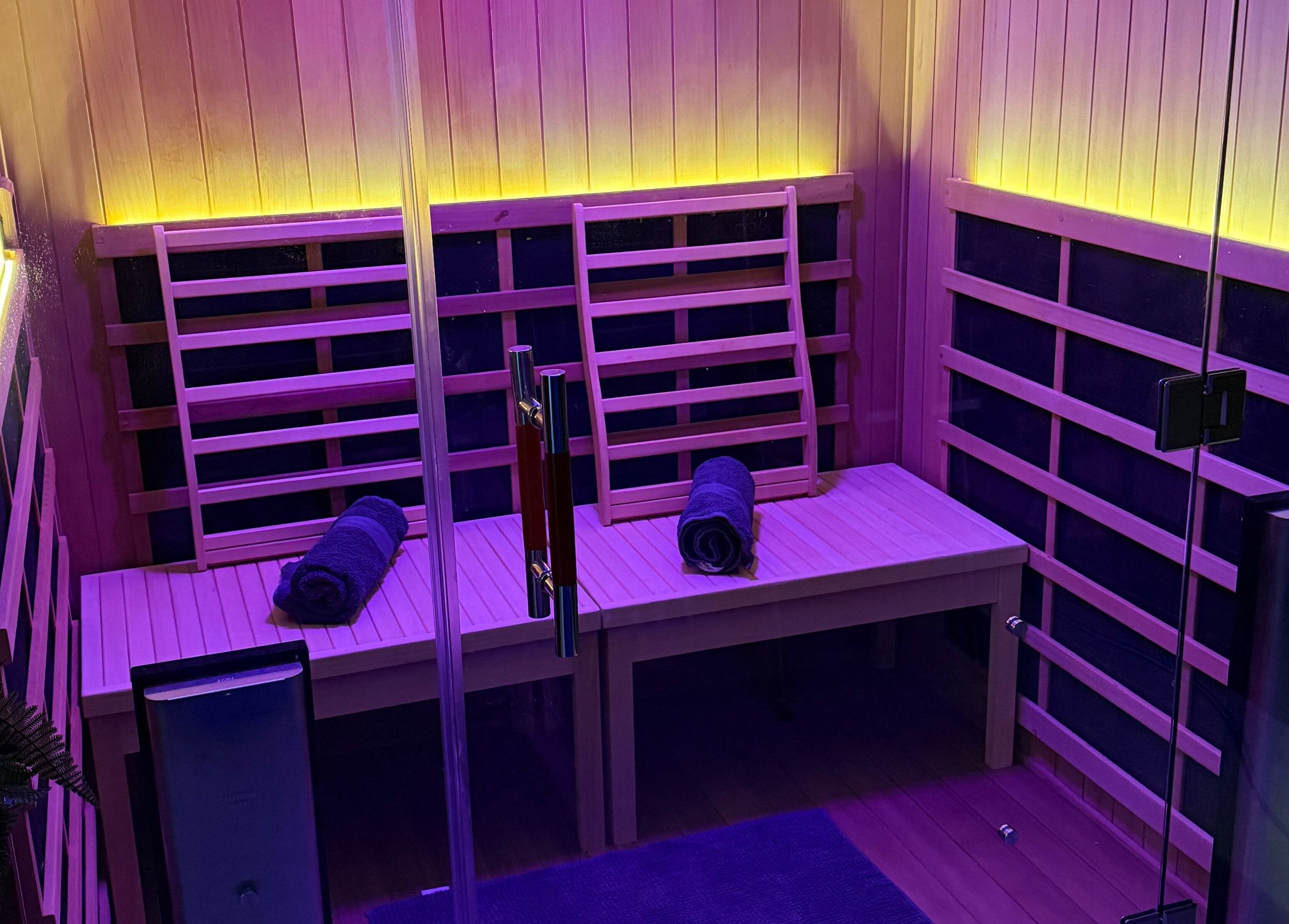 Luxurious sauna with purple lighting at Recover and Refresh, Grafton, New South Wales, AU.