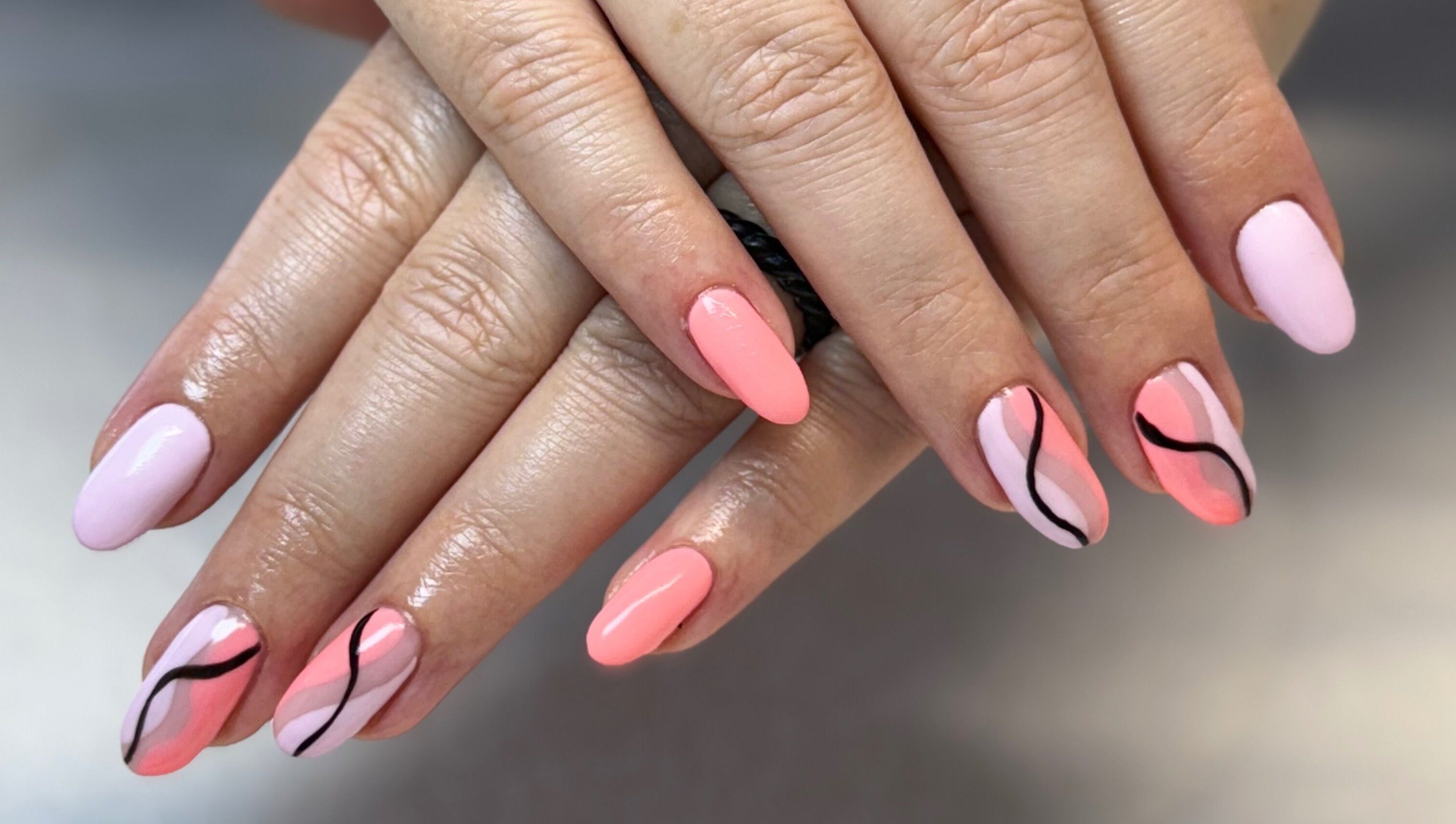 Elegant nail art with pink and black wavy designs at Creative Touch by RK, Tauranga, Bay of Plenty, NZ.