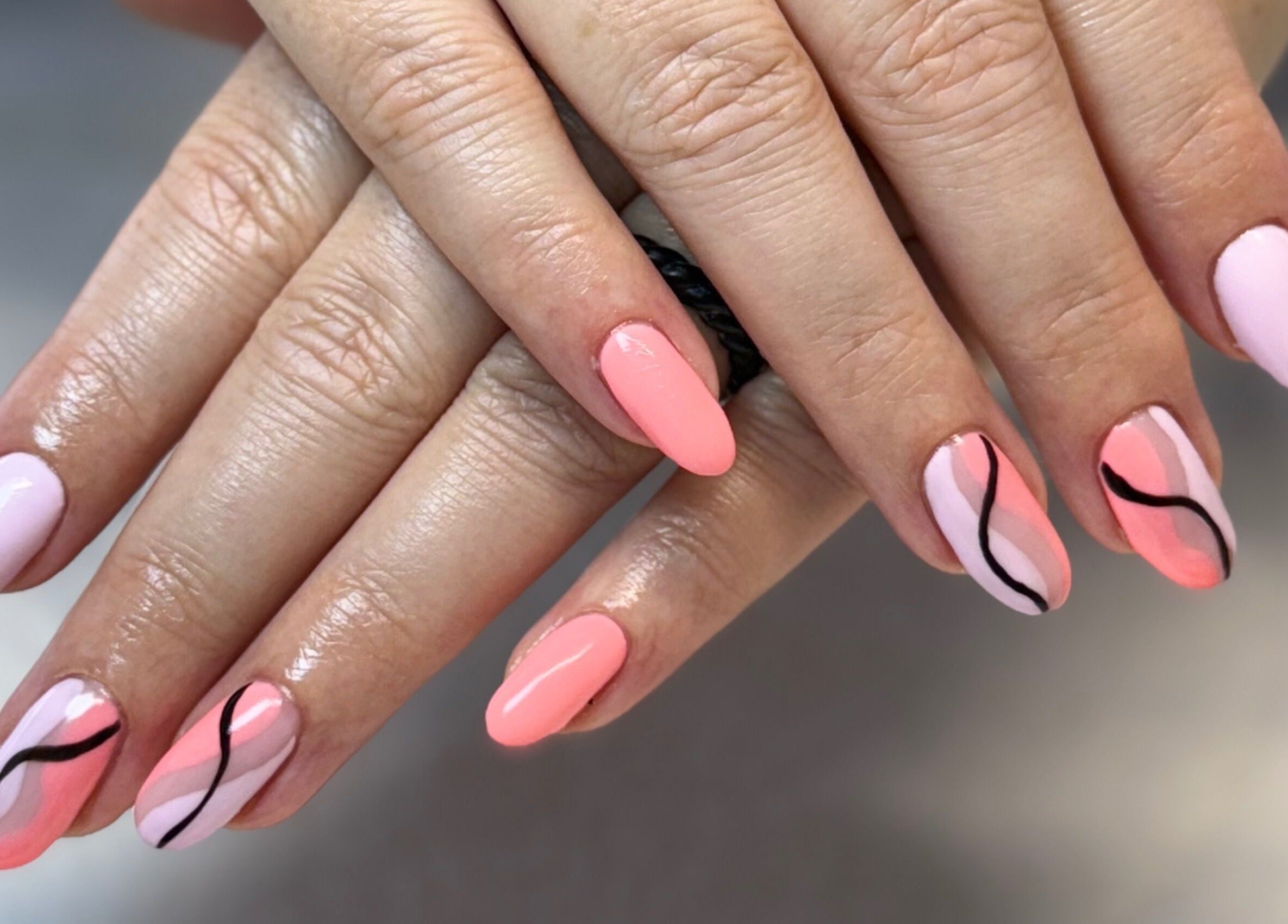 Elegant nail art with pink and black wavy designs at Creative Touch by RK, Tauranga, Bay of Plenty, NZ.