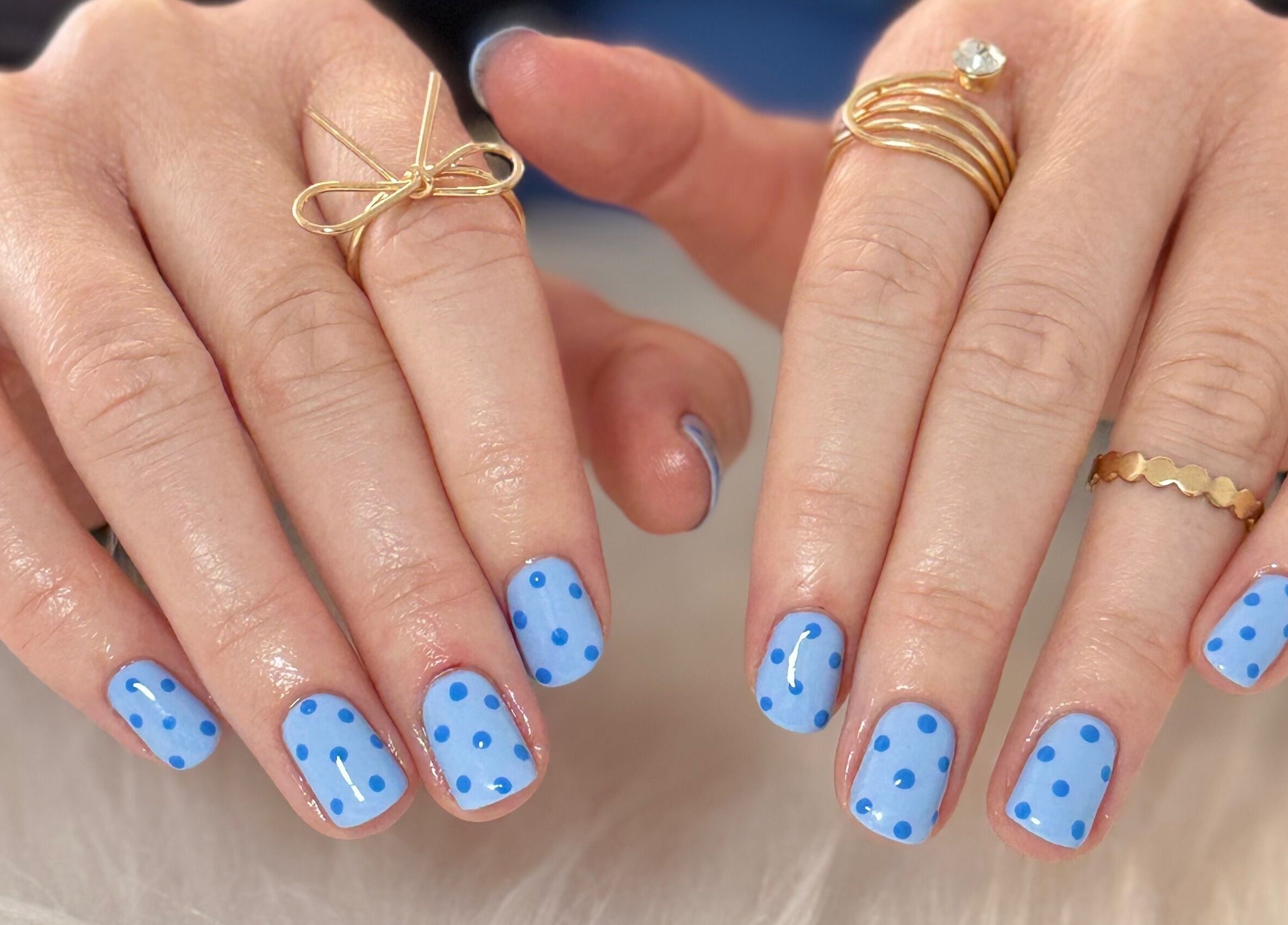 Polished blue nails with dot design at Creative Touch by RK in Tauranga, Bay of Plenty, NZ.