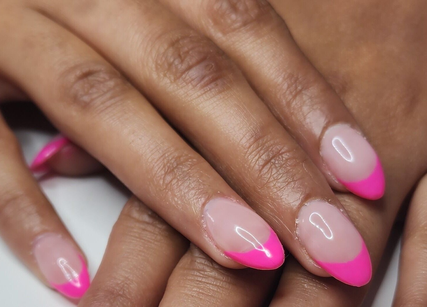 Close-up of vibrant neon pink french manicure at Creative Touch by RK, Tauranga, Bay of Plenty, NZ.