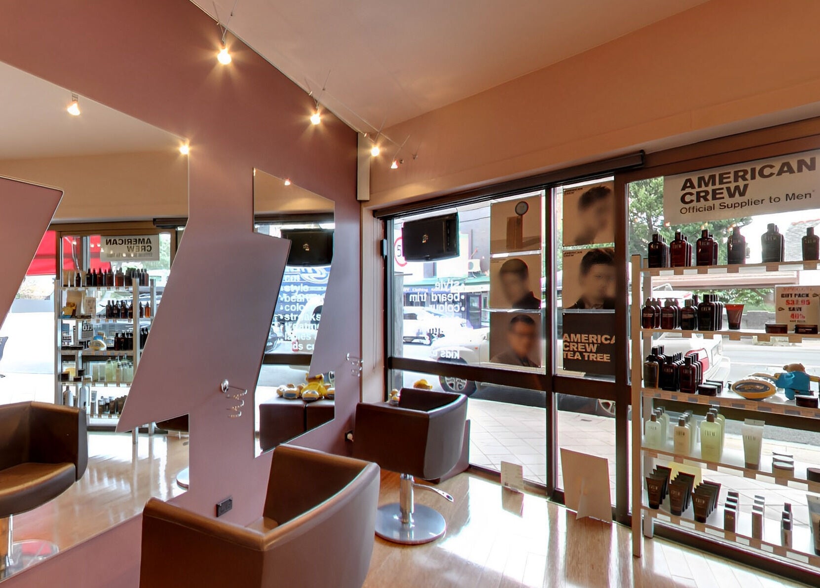 Modern salon interior at Jazz Man Hair Gallery, Bondi Junction, New South Wales, AU with products and styling chairs.