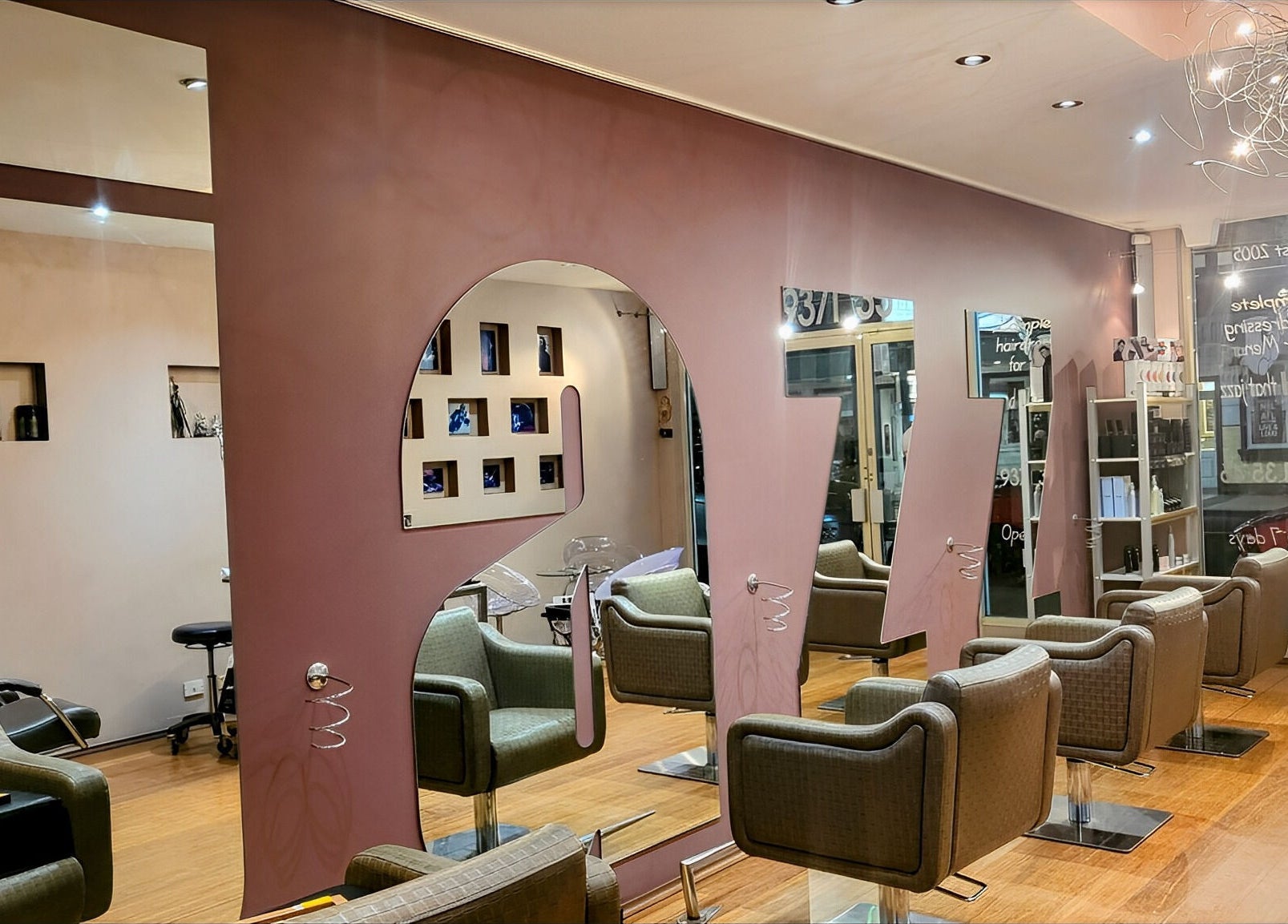 Chic salon interior at Jazz Man Hair Gallery, Bondi Junction, New South Wales, AU with modern chairs and mirrors.