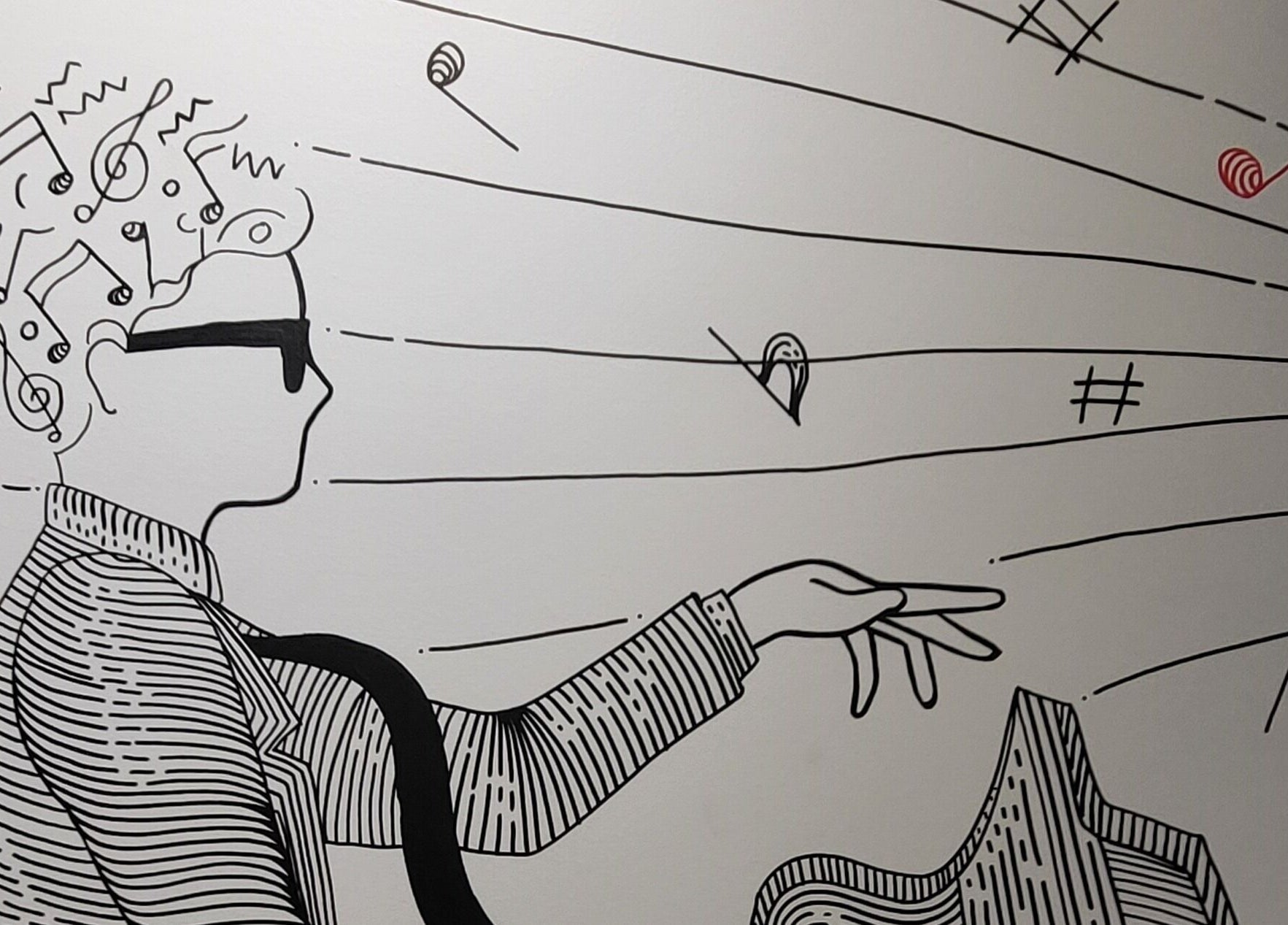 Artistic mural at Jazz Man Hair Gallery, Bondi Junction, New South Wales, AU, depicting a musician with musical notes.