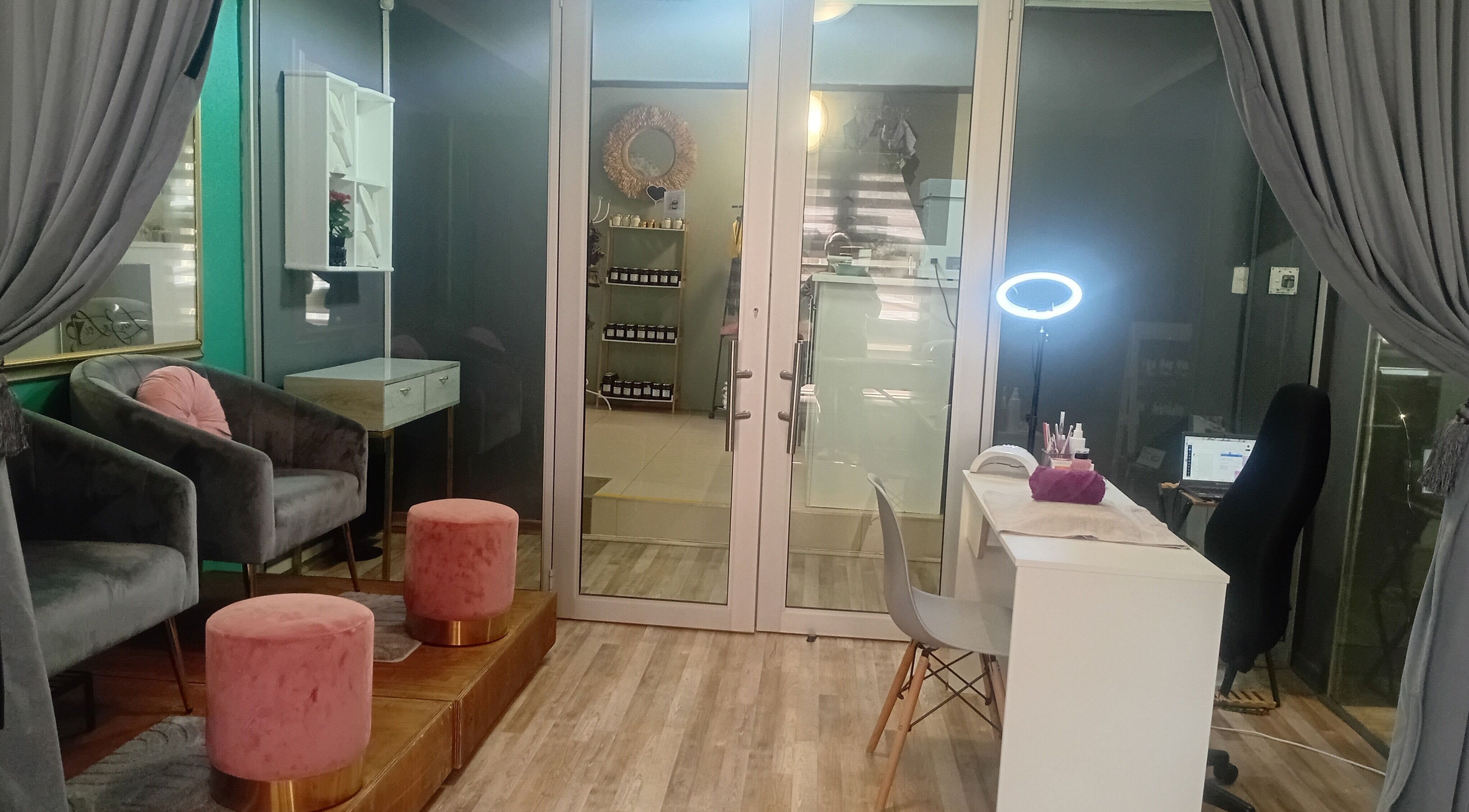 Modern beauty lounge at Betty's Touch Beauty, Pretoria, Gauteng, ZA with plush seating and nail care station.