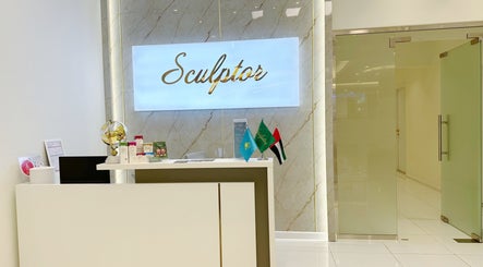 Reception area at Sculptor by Aray Kairkanova Beauty Center in Abu Dhabi featuring modern decor.