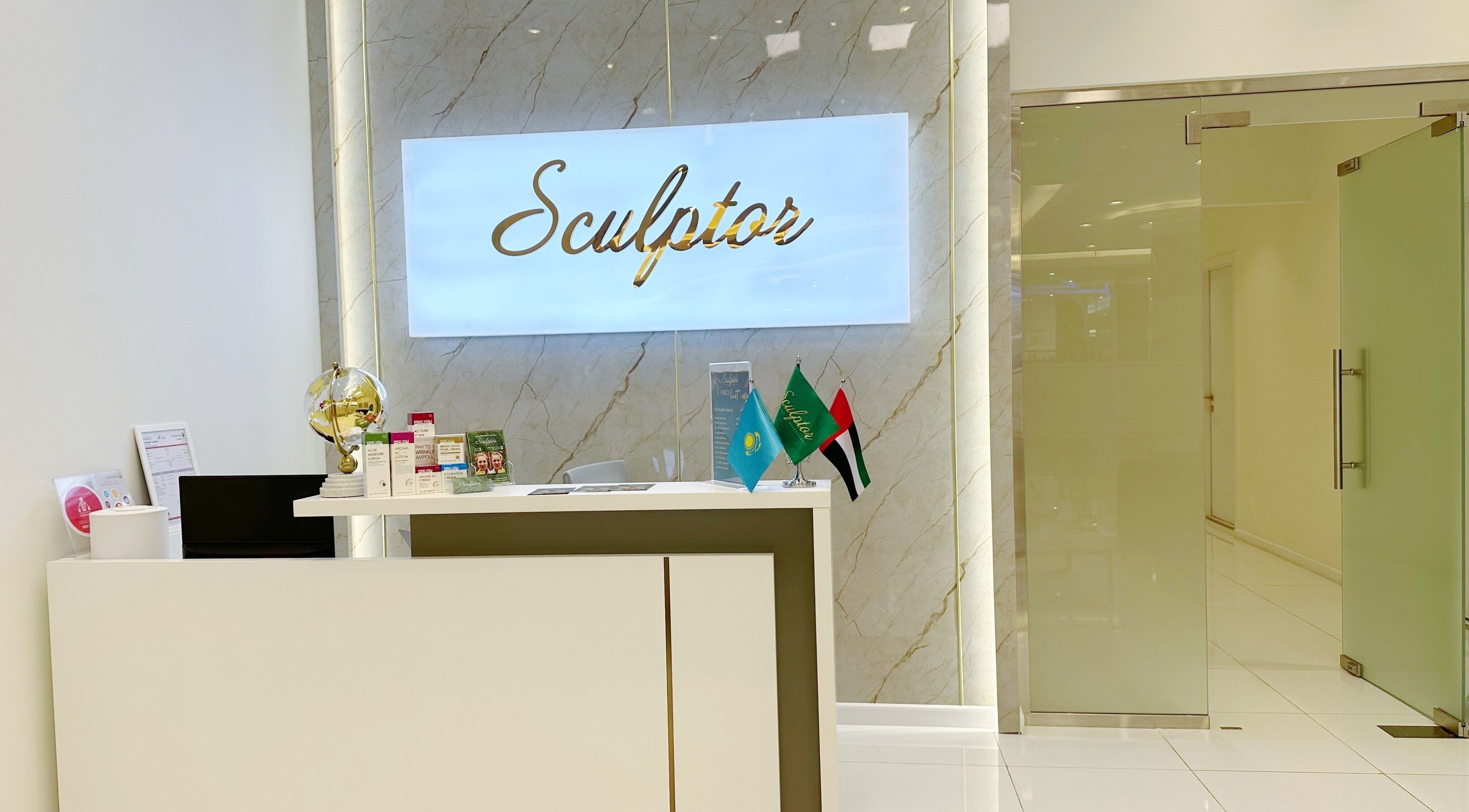 Reception area at Sculptor by Aray Kairkanova Beauty Center in Abu Dhabi featuring modern decor.