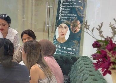 Customers receiving a beauty consultation at Sculptor by Aray Kairkanova Beauty center, Abu Dhabi, AE.