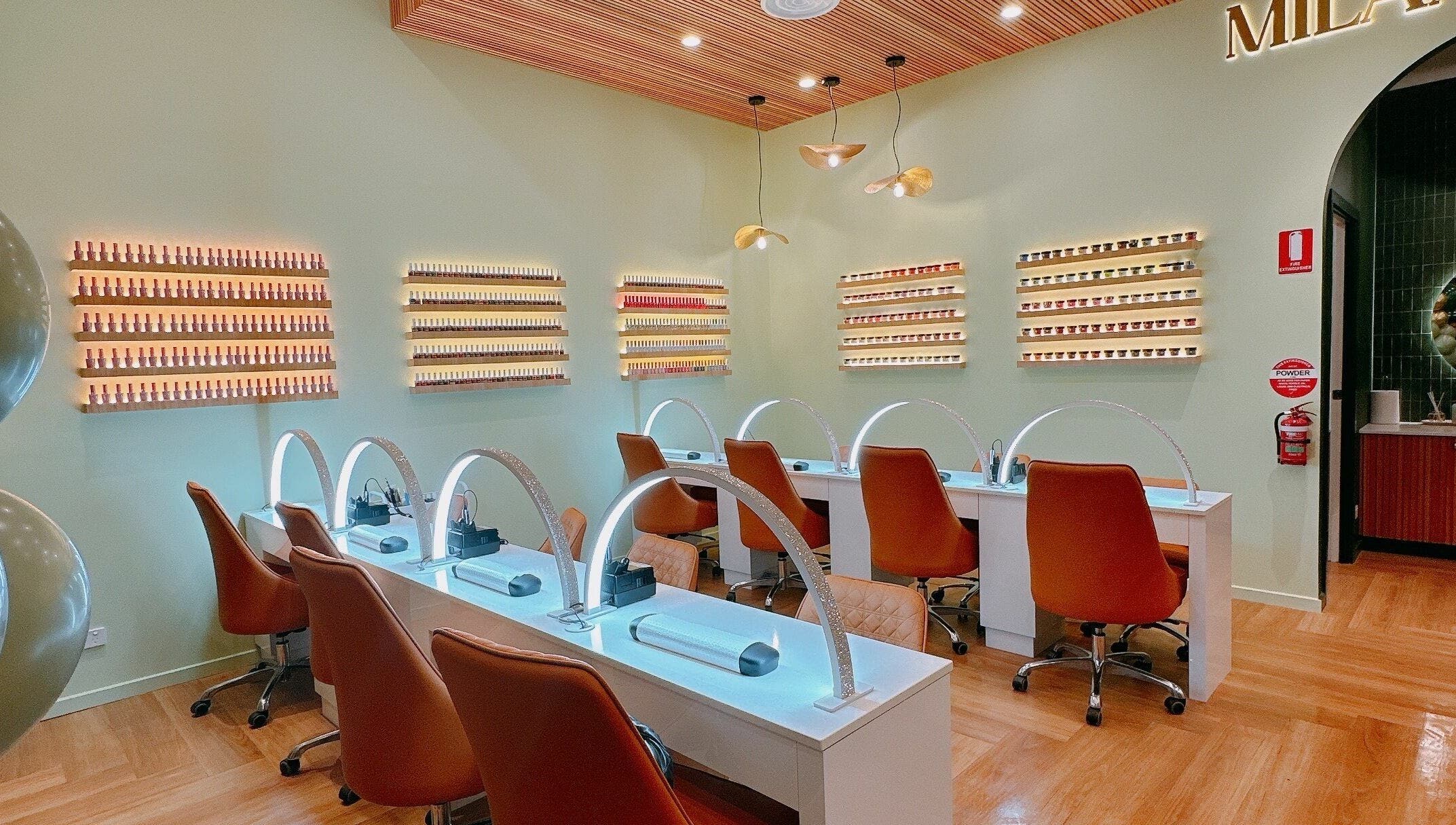 Modern interior of Milano Nails Southland, Melbourne, Victoria, AU with stylish nail stations and displays.