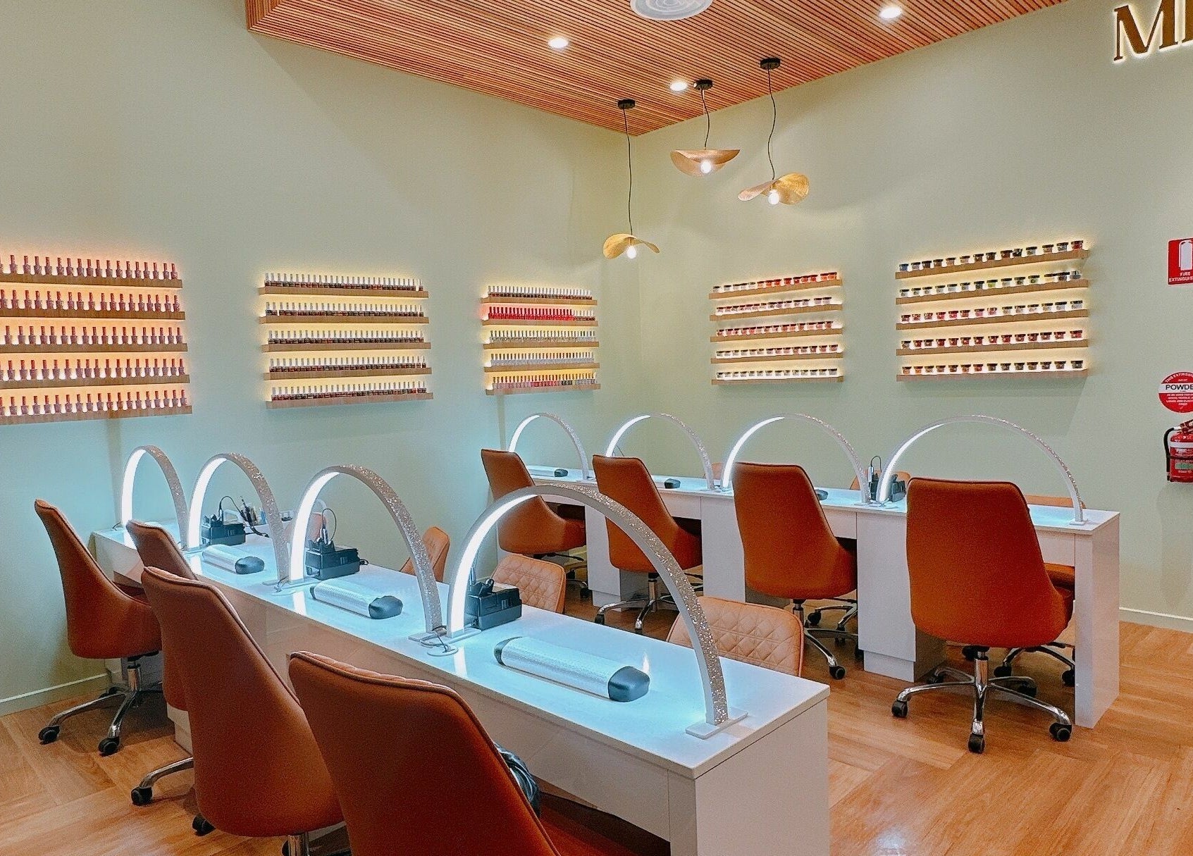 Modern interior of Milano Nails Southland, Melbourne, Victoria, AU with stylish nail stations and displays.