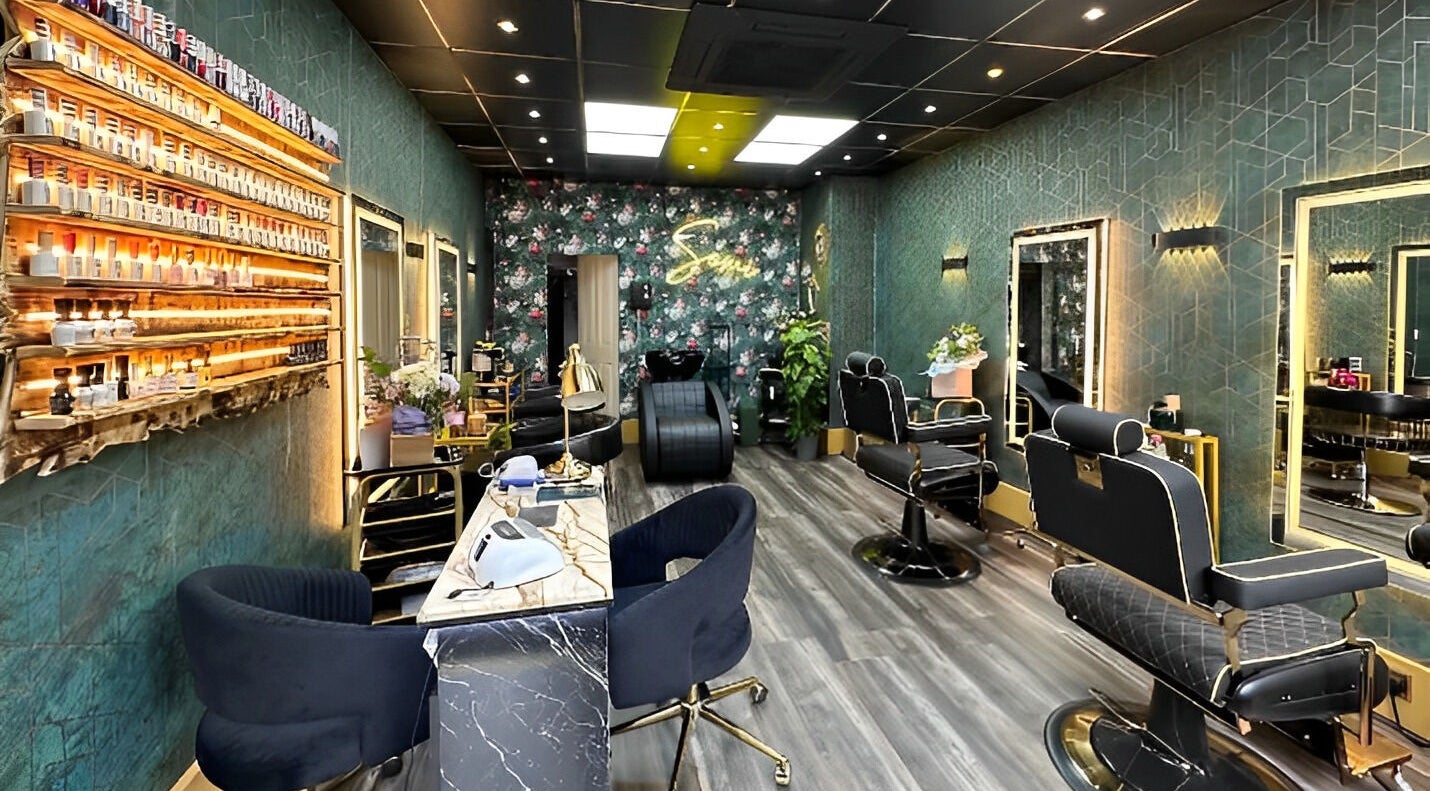 Chic interior of Somi’s Hair and Beauty in Glasgow, Scotland, GB, showcasing stylish chairs and polished decor.