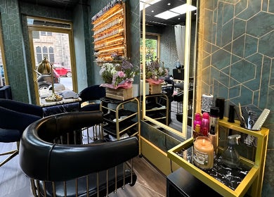 Chic interior of Somi’s Hair and Beauty in Glasgow, Scotland, GB, featuring elegant decor and styling stations.