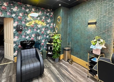 Chic floral interior of Somi’s Hair and Beauty in Glasgow, Scotland, GB showcases elegant styling stations.