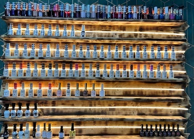 A vibrant nail polish display at Somi’s Hair and Beauty, Glasgow, Scotland, GB.