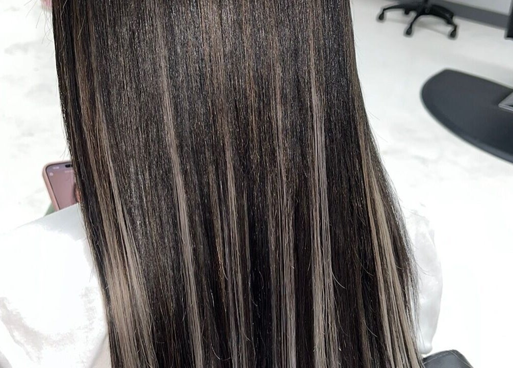 Sleek straight hair at Glam Sanctuary, Stone Mountain, Georgia, US, showcasing salon's styling expertise.