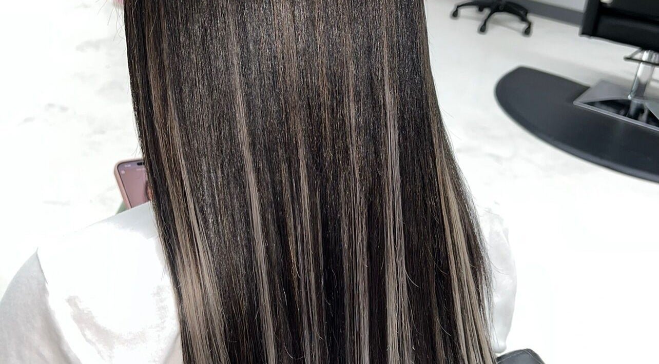 Sleek straight hair at Glam Sanctuary, Stone Mountain, Georgia, US, showcasing salon's styling expertise.