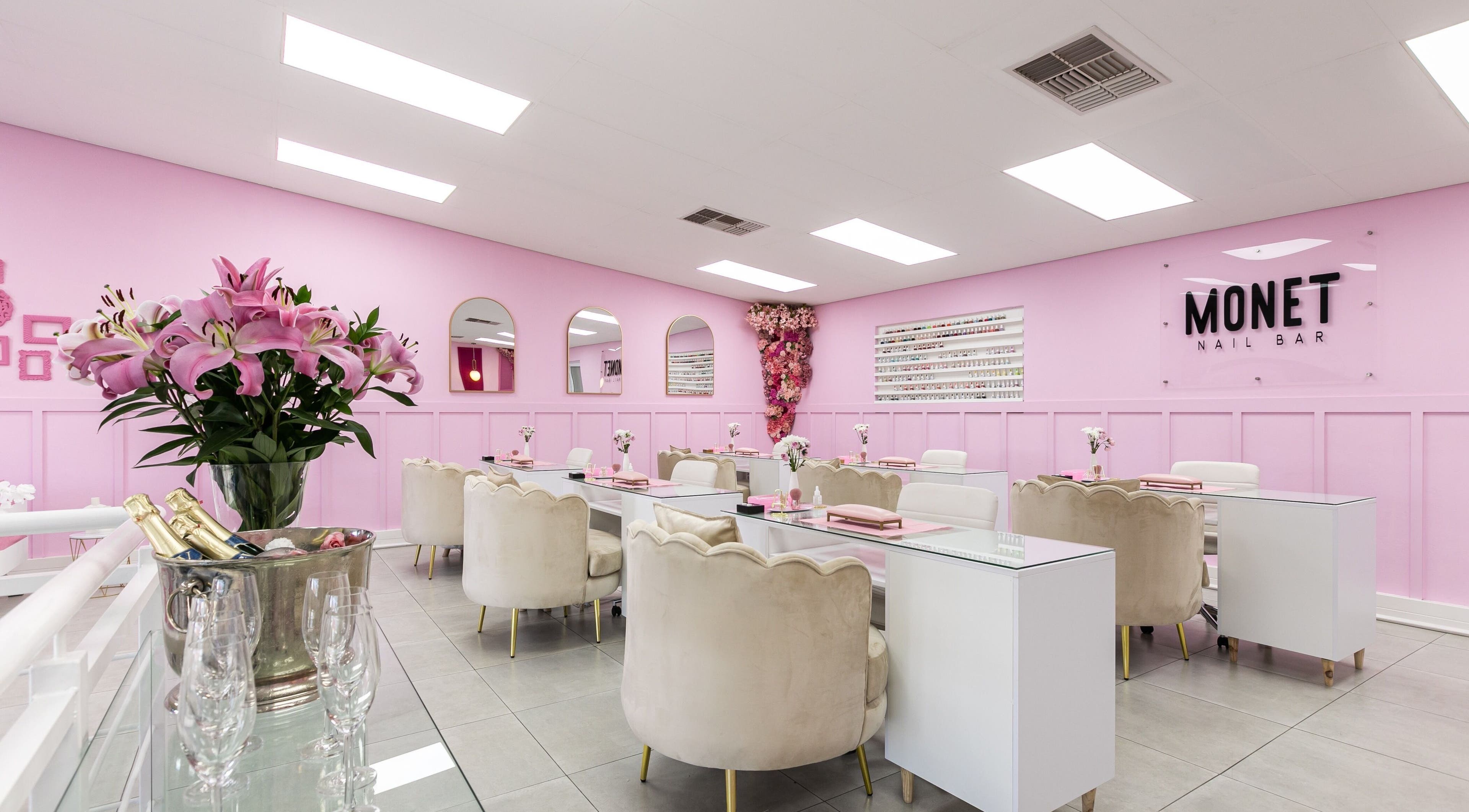 Interior of Monét Beauty Bar in Randburg, Gauteng, ZA with pink decor and elegant seating.