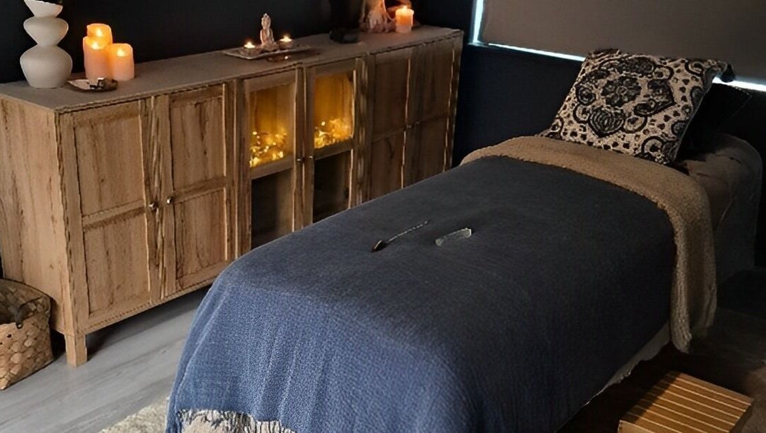 Relaxing therapy room at Riversview Reiki, Callan, County Kilkenny, IE, with candles and cozy decor.