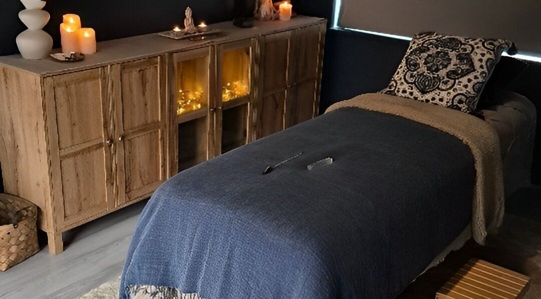 Relaxing therapy room at Riversview Reiki, Callan, County Kilkenny, IE, with candles and cozy decor.