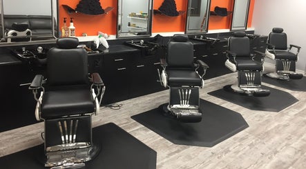 Modern barber chairs at Thumbs Up Barber Shop in Kitchener, Ontario, CA, with sleek interiors.