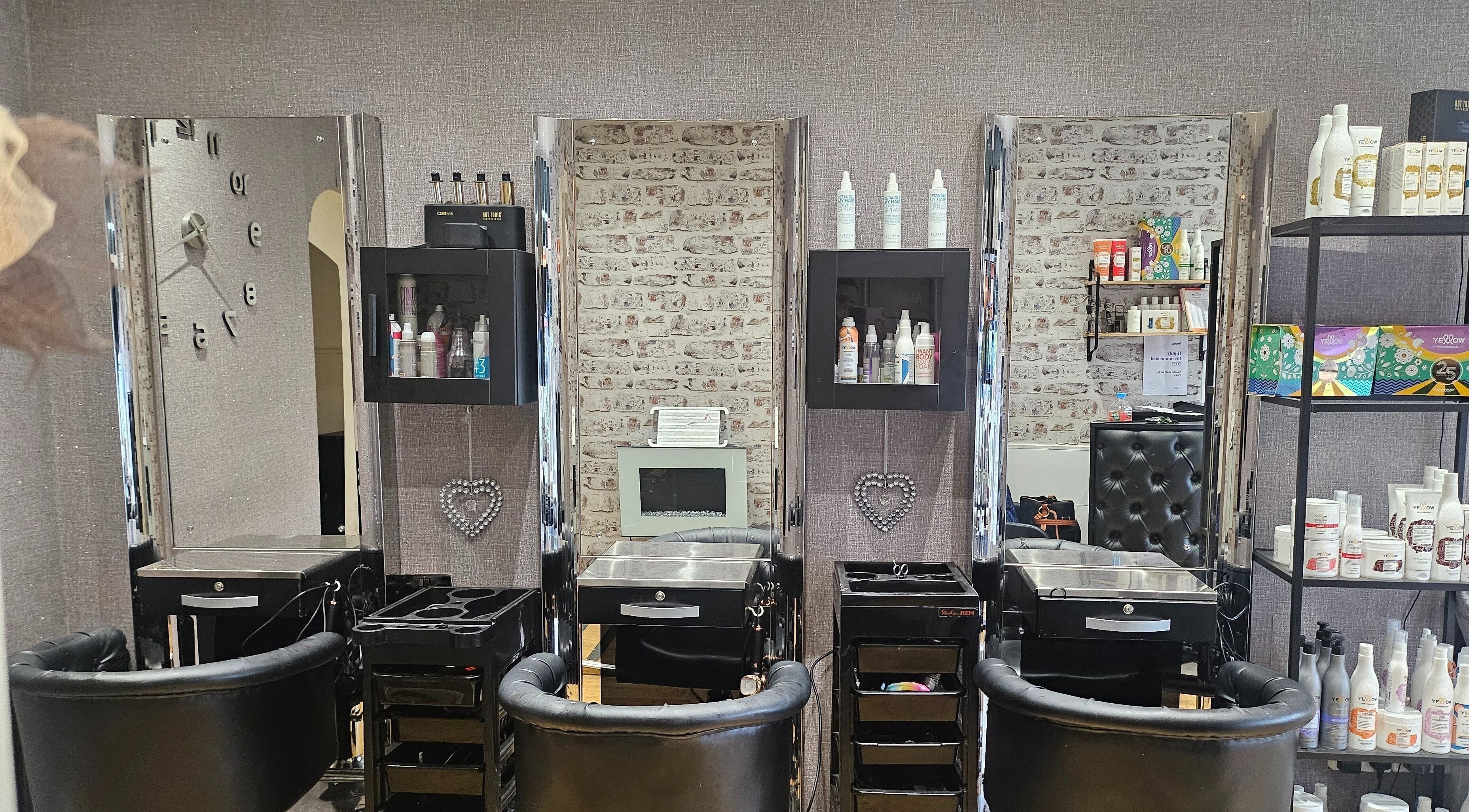 Elegant salon stations at Headin Out Hair & Beauty, Preston, England, GB, showcasing modern styling chairs.