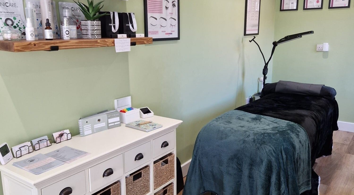 Tranquil spa room at Cherry Tree Beauty in Yaxley, England, GB with treatment bed and skincare products.