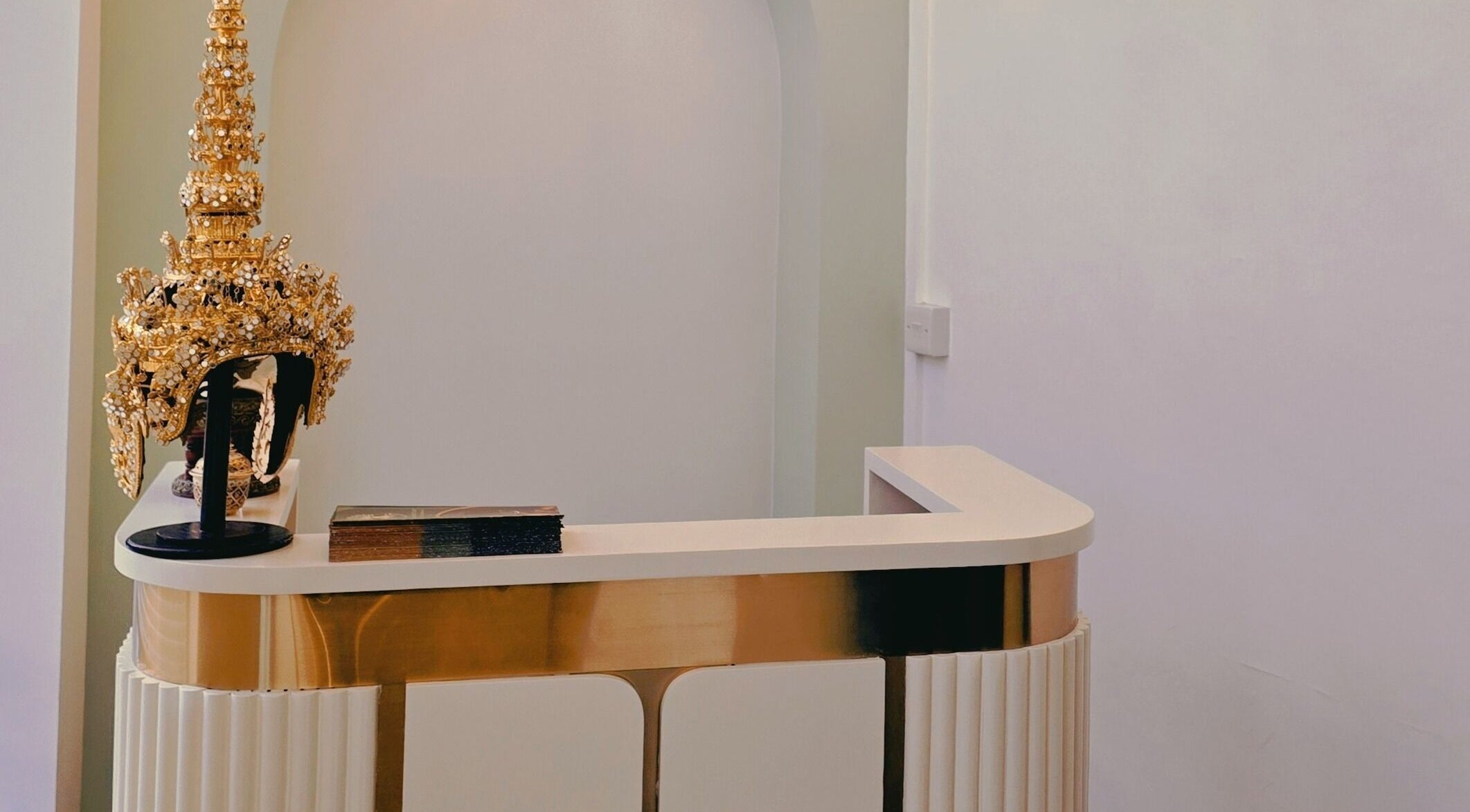 Elegant reception at The Andaman Sanctuary, Twickenham, England, with a golden decorative piece.